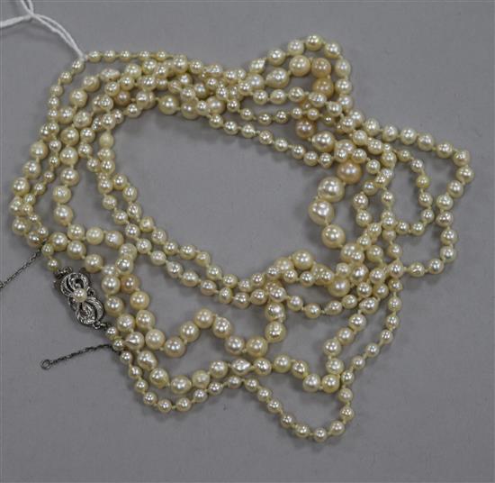 A long single strand graduated baroque cultured pearl necklace, with 14ct white gold Mikimoto clasp, 160cm.